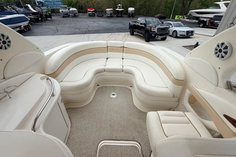 Slide: The Image of 2002 Sea Ray 290 Bowrider interior with plush seating and modern amenities. - 14