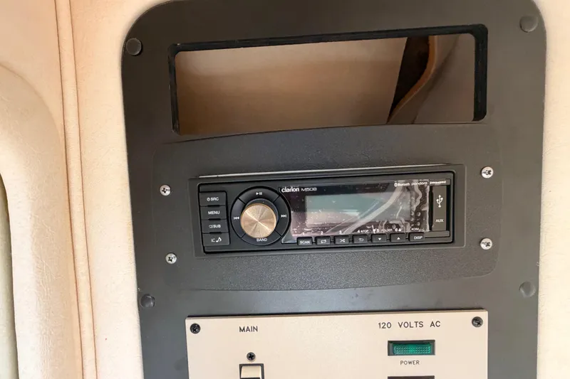 Slide: The Image of 2002 Sea Ray 290 Bowrider stereo system and control panel with Clarion M508 unit. - 25