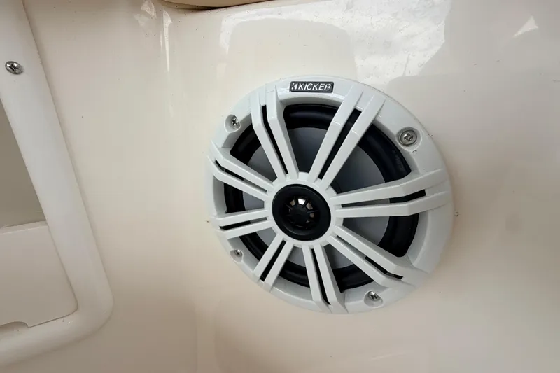 Slide: The Image of Kicker speaker installed on 2002 Sea Ray 290 Bowrider boat interior. - 26
