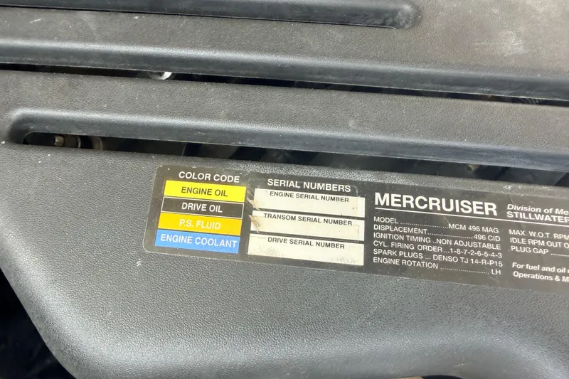 Slide: The Image of Engine label on a 2002 Sea Ray 290 Bowrider, detailing MerCruiser specifications and fluid color codes. - 40