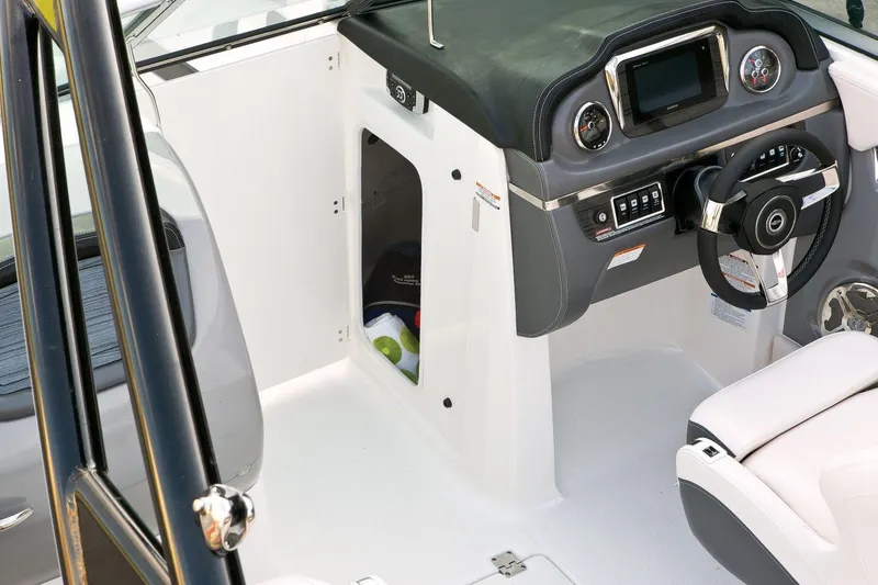 Slide: The Image of Manufacturer Provided Image: 2016 Chaparral 246 SSi boat cockpit with steering wheel and control panel. - 12