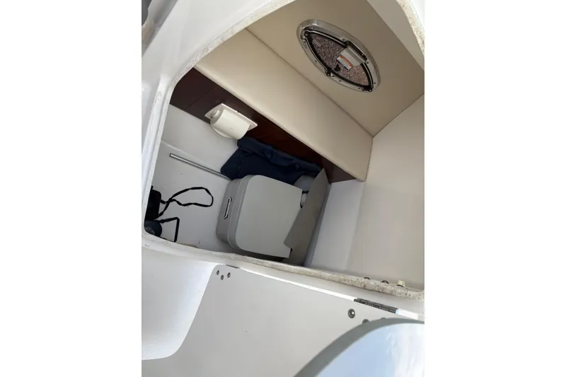 Slide: The Image of Interior cabin of 2016 Chaparral 246 SSi boat with seating and storage. - 6
