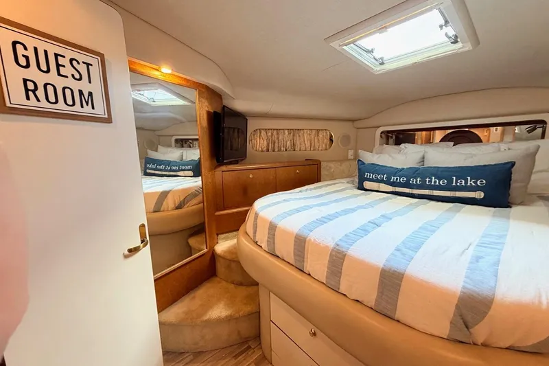 Slide: The Image of Guest room in 1997 Sea Ray 420 Aft Cabin with cozy bed and nautical decor. - 17
