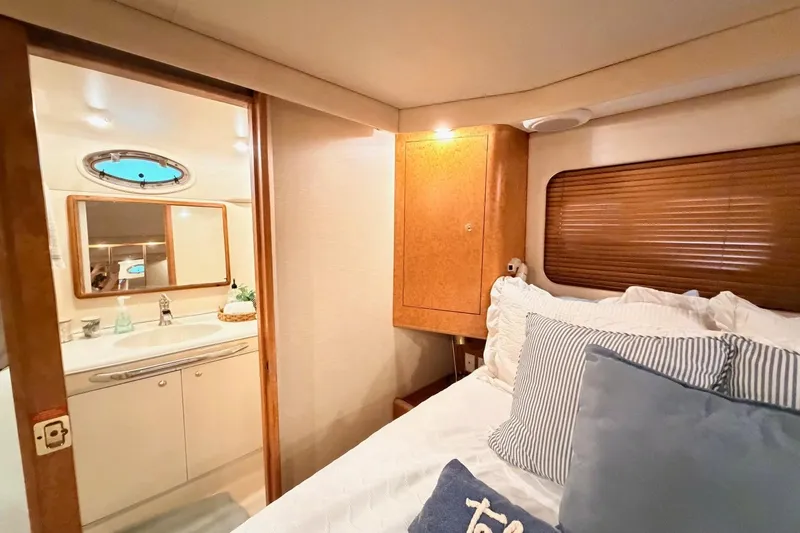 Slide: The Image of Cozy bedroom and bathroom in 1997 Sea Ray 420 Aft Cabin yacht. - 22