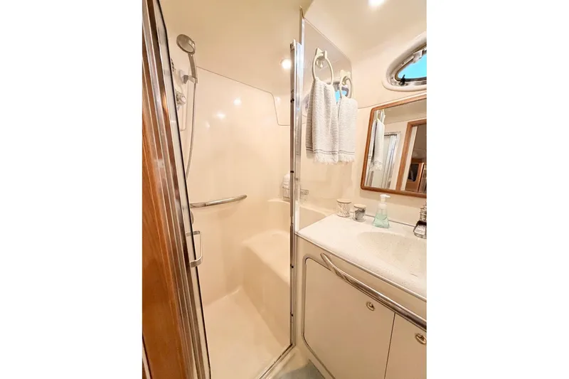 Slide: The Image of Bathroom interior of 1997 Sea Ray 420 Aft Cabin yacht with shower and vanity. - 26