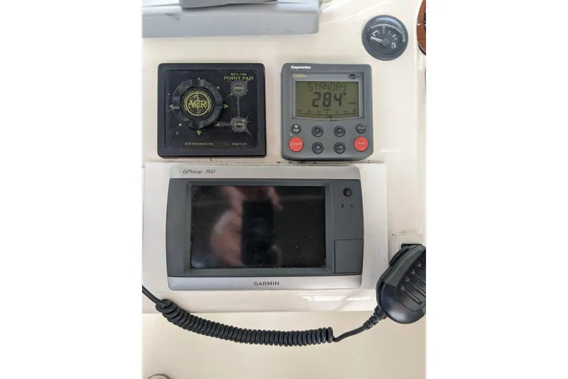Slide: The Image of Control panel of a 1996 Sea Ray 420 Aft Cabin with navigation equipment. - 32