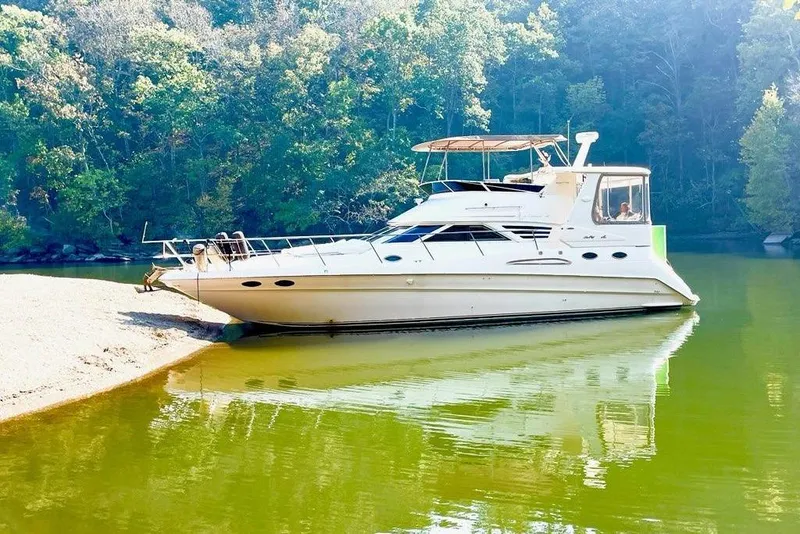 Slide: The Image of Engine compartment of a 1996 Sea Ray 420 Aft Cabin boat, featuring a Caterpillar engine. - 36