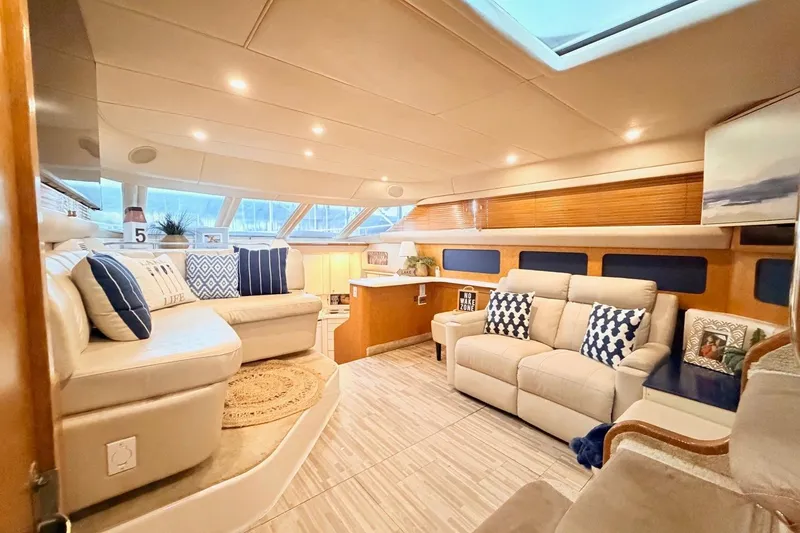 Slide: The Image of Luxurious interior of 1997 Sea Ray 420 Aft Cabin yacht with elegant seating and decor. - 6