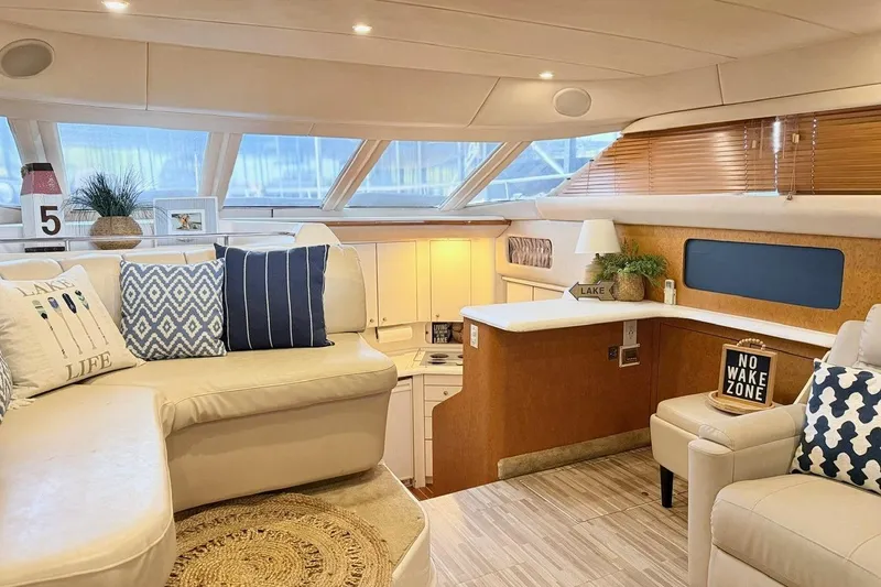 Slide: The Image of Luxurious interior of a 1997 Sea Ray 420 Aft Cabin yacht with elegant decor. - 9