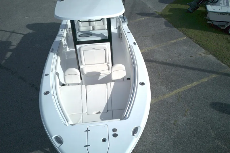 Slide: The Image of 2024 Sea Hunt Gamefish 25 boat with spacious seating and sleek design. - 13