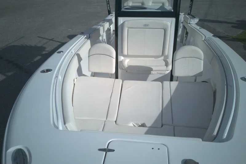 Slide: The Image of 2024 Sea Hunt Gamefish 25 boat interior with cushioned seating and sleek design. - 3