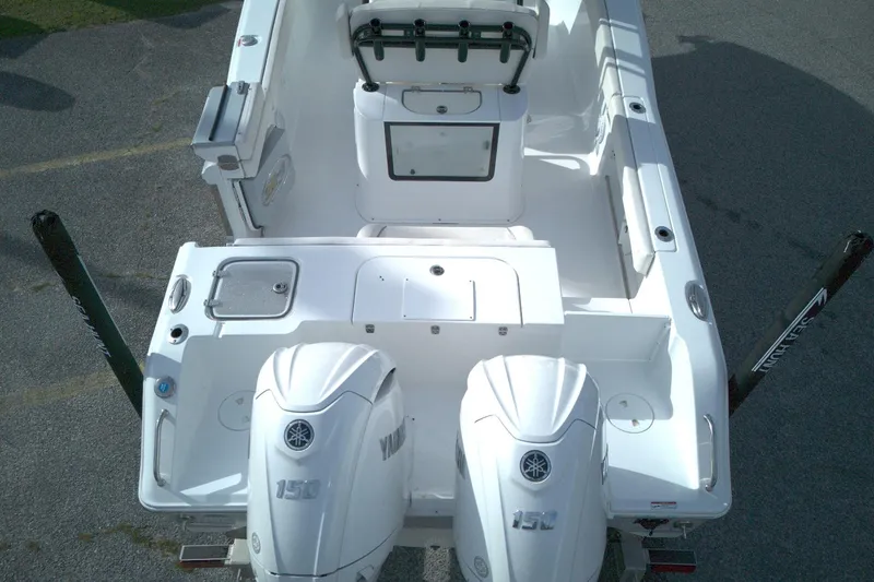 Slide: The Image of 2024 Sea Hunt Gamefish 25 boat with dual Yamaha engines, viewed from above. - 4
