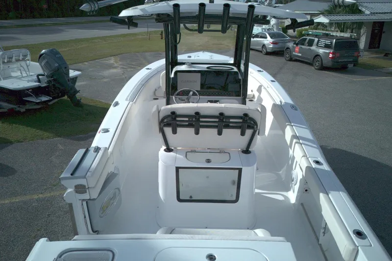 Slide: The Image of 2024 Sea Hunt Gamefish 25 boat interior, featuring a spacious deck and modern console. - 7