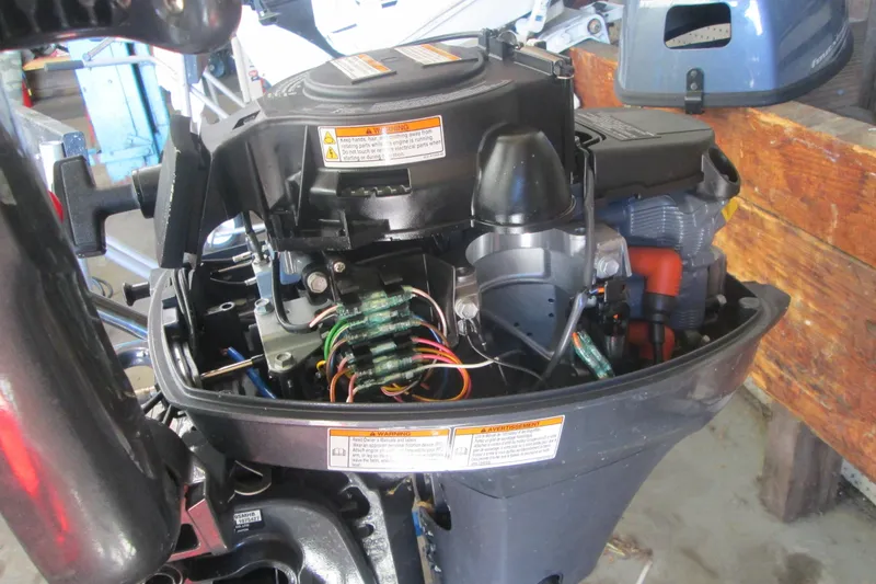 Slide: The Image of 2023 Zodiac Cadet 310 Alu outboard motor, internal components exposed in a workshop setting. - 4