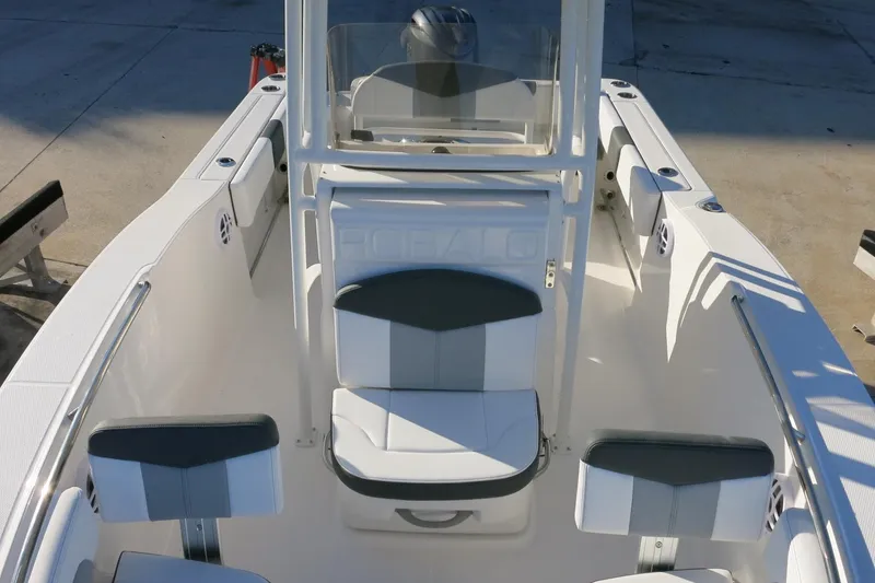 Slide: The Image of 2026 Robalo R202 Explorer boat interior with seating and console, showcasing modern design. - 10