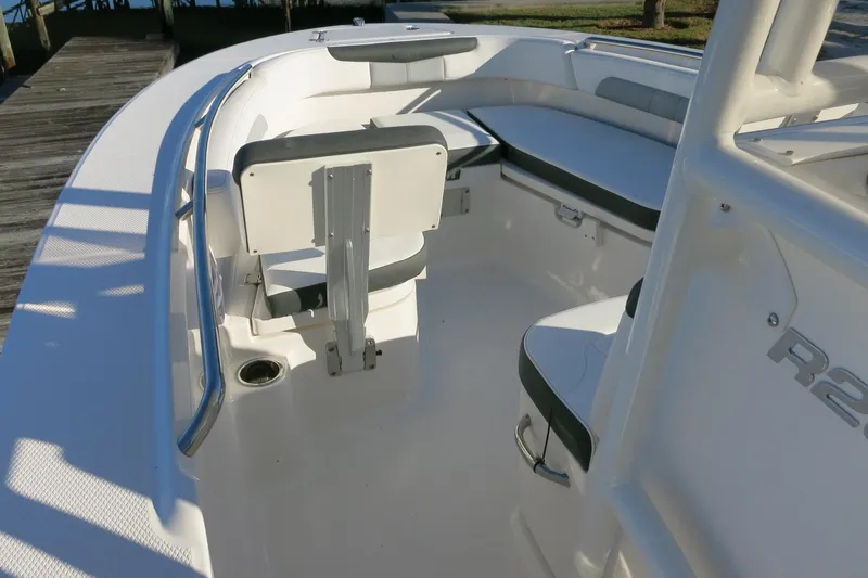 Slide: The Image of 2026 Robalo R202 Explorer boat interior with seating and railings. - 11