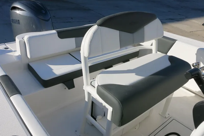 Slide: The Image of 2026 Robalo R202 Explorer boat interior with cushioned seating and Yamaha engine. - 13