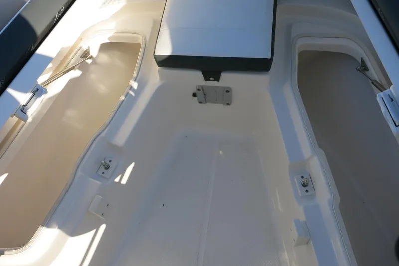 Slide: The Image of Interior storage compartments of 2026 Robalo R202 Explorer boat. - 16