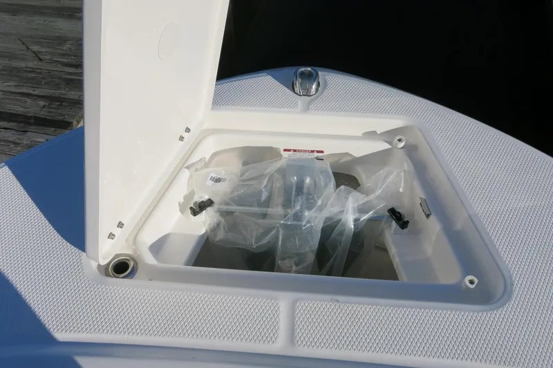 Slide: The Image of Open storage compartment on 2026 Robalo R202 Explorer boat deck. - 17