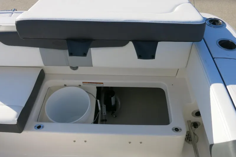 Slide: The Image of 2026 Robalo R202 Explorer boat interior with storage compartment and seating. - 18