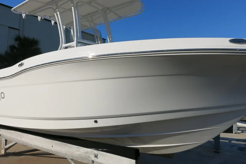 Slide: The Image of 2026 Robalo R202 Explorer boat on display, showcasing sleek white hull design. - 2