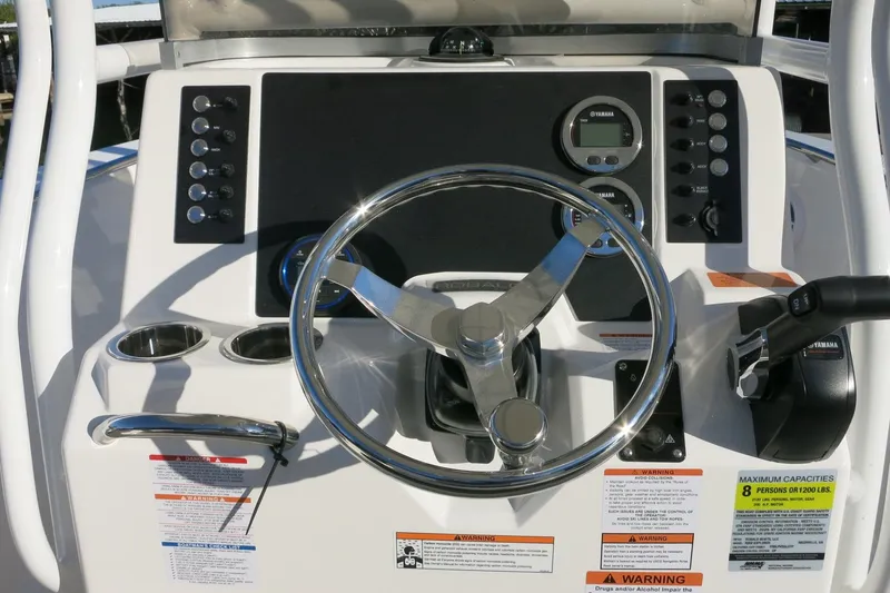 Slide: The Image of Steering console of 2026 Robalo R202 Explorer boat with controls and gauges. - 22