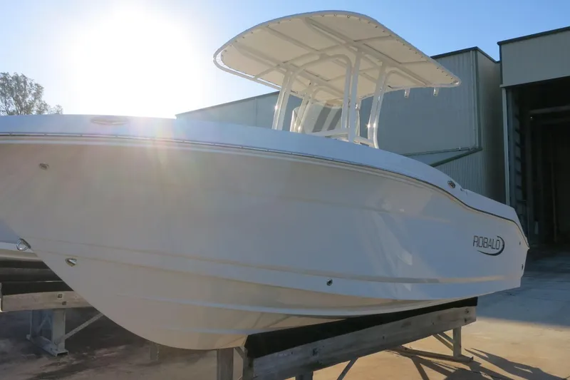 Slide: The Image of 2026 Robalo R202 Explorer boat with sleek design, docked under sunlight. - 3