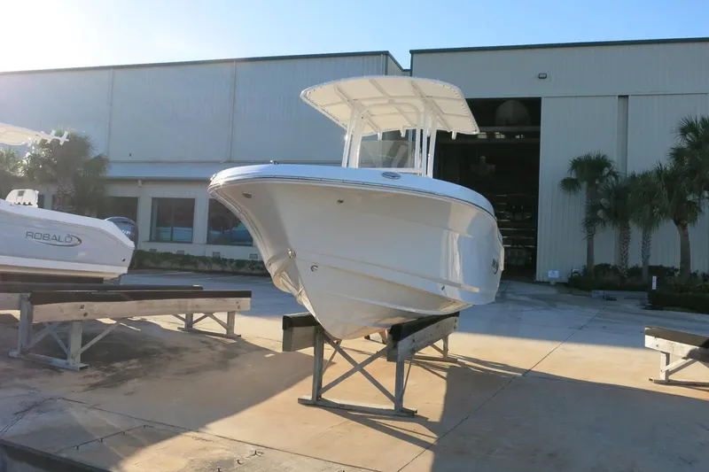 Slide: The Image of 2026 Robalo R202 Explorer boat displayed outside a warehouse. - 7