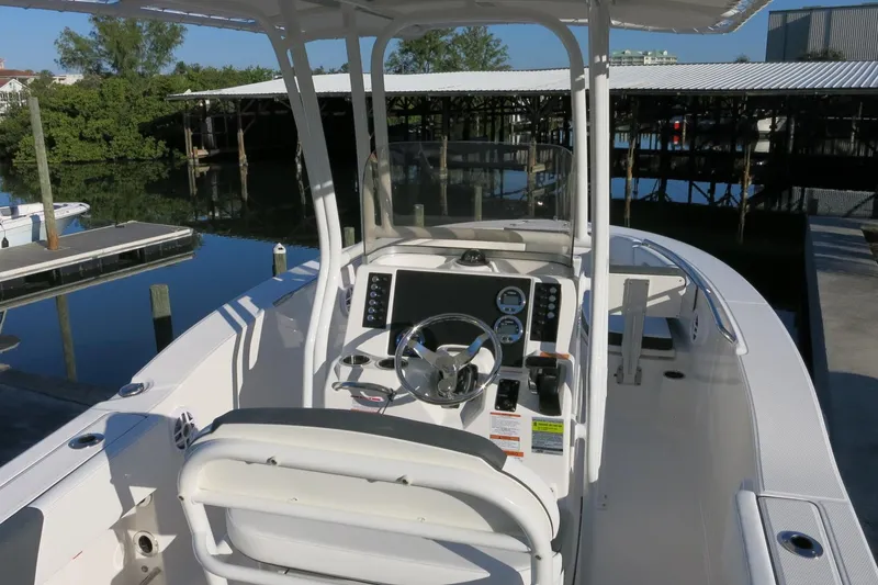 Slide: The Image of 2026 Robalo R202 Explorer boat interior with steering console and seating. - 8