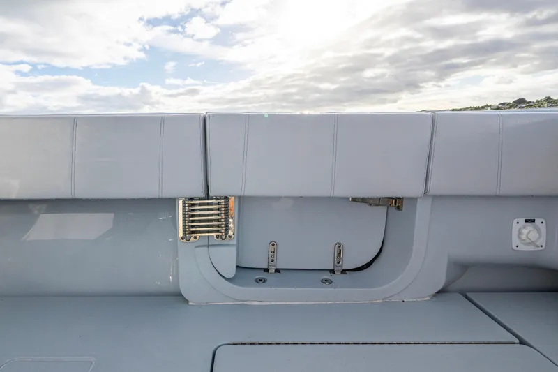 Slide: The Image of Rear view of 2024 Contender 44 ST boat deck under cloudy sky. - 17