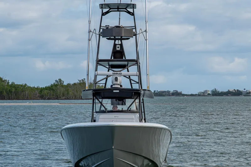 Slide: The Image of 2024 Contender 44 ST boat on water, front view with tower and electronics. - 2