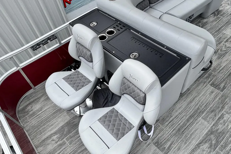 Slide: The Image of 2025 Ranger Reata 220FC boat interior with plush seating and fishing station. - 10
