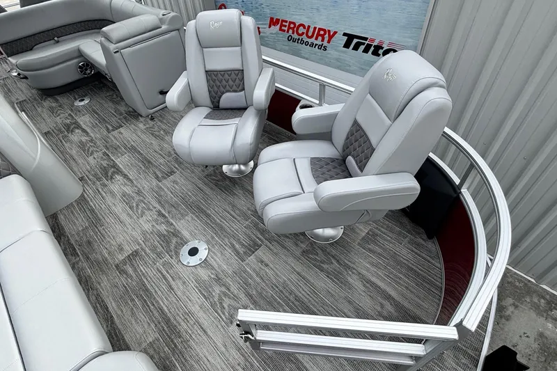 Slide: The Image of 2025 Ranger Reata 220FC boat interior with plush seating and modern flooring. - 4