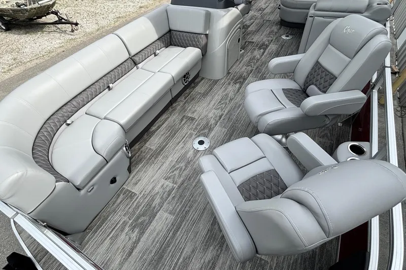 Slide: The Image of 2025 Ranger Reata 220FC boat interior with luxurious gray seating and modern design. - 5