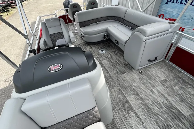 Slide: The Image of 2025 Ranger Reata 220FC boat interior with gray seating and modern design. - 7
