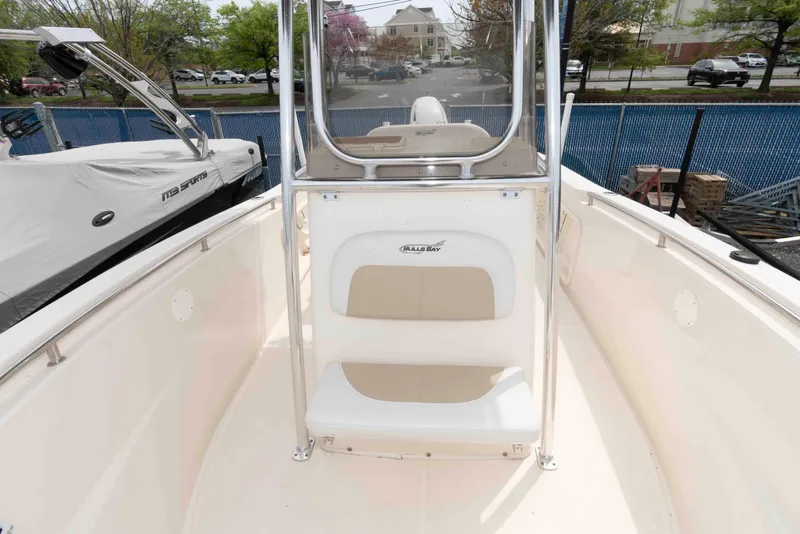 Slide: The Image of 2023 Bulls Bay 230 Center Console boat interior with seating and console view. - 9