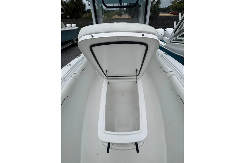 Slide: The Image of 2017 Sea Hunt Gamefish 30 boat with open storage compartment. - 10
