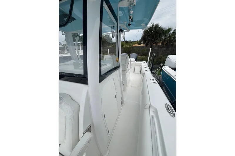 Slide: The Image of 2017 Sea Hunt Gamefish 30 boat deck, featuring sleek white design and spacious layout. - 12