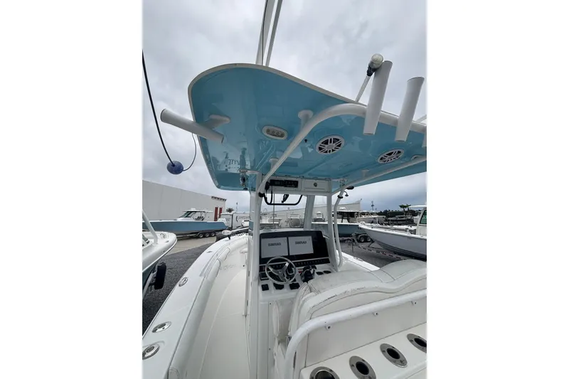 Slide: The Image of 2017 Sea Hunt Gamefish 30 boat interior with blue canopy and control panel. - 15