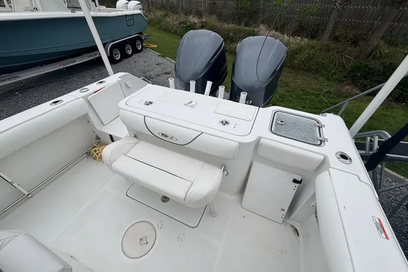 Slide: The Image of 2017 Sea Hunt Gamefish 30 boat interior with dual engines and seating area. - 18