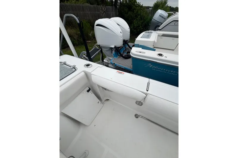 Slide: The Image of 2017 Sea Hunt Gamefish 30 boat interior with outboard motor and seating area. - 19