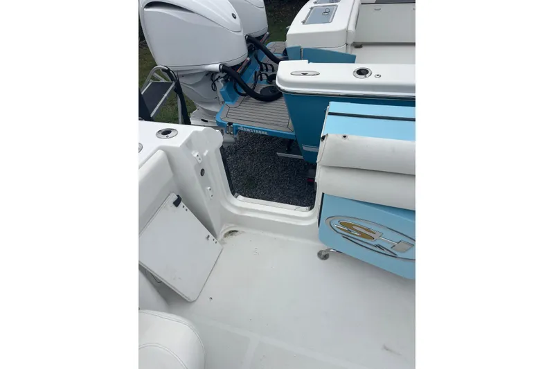 Slide: The Image of 2017 Sea Hunt Gamefish 30 boat interior with dual engines and seating area. - 20