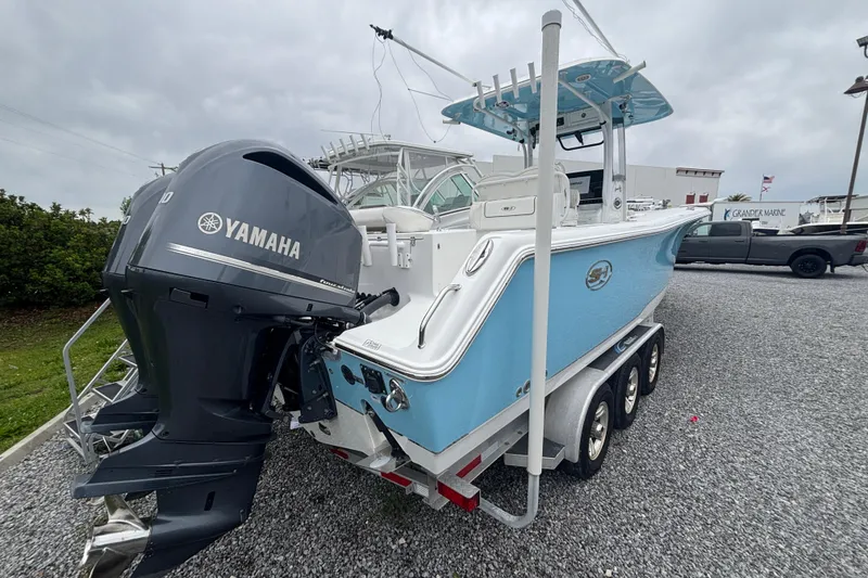 Slide: The Image of 2017 Sea Hunt Gamefish 30 boat with Yamaha engine on a trailer. - 4