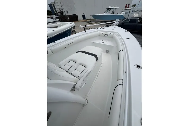 Slide: The Image of 2017 Sea Hunt Gamefish 30 boat interior with white seating and spacious deck. - 7