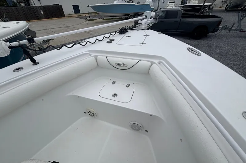 Slide: The Image of 2017 Sea Hunt Gamefish 30 boat deck with storage compartments and seating. - 8