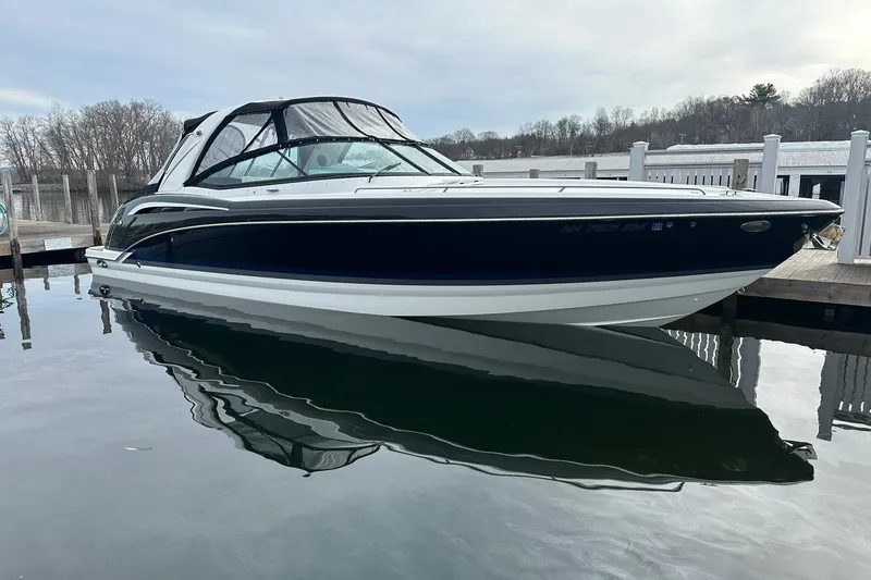 The Image of 2012 Formula 350 FX6 boat docked on calm water, showcasing sleek design. - 0