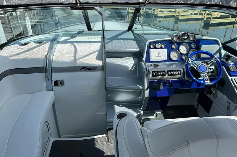 Slide: The Image of Interior of 2012 Formula 350 FX6 boat with modern dashboard and steering wheel. - 10