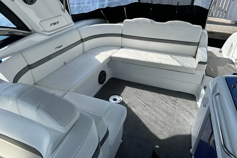 Slide: The Image of Interior of 2012 Formula 350 FX6 boat with white seating and carpeted floor. - 15