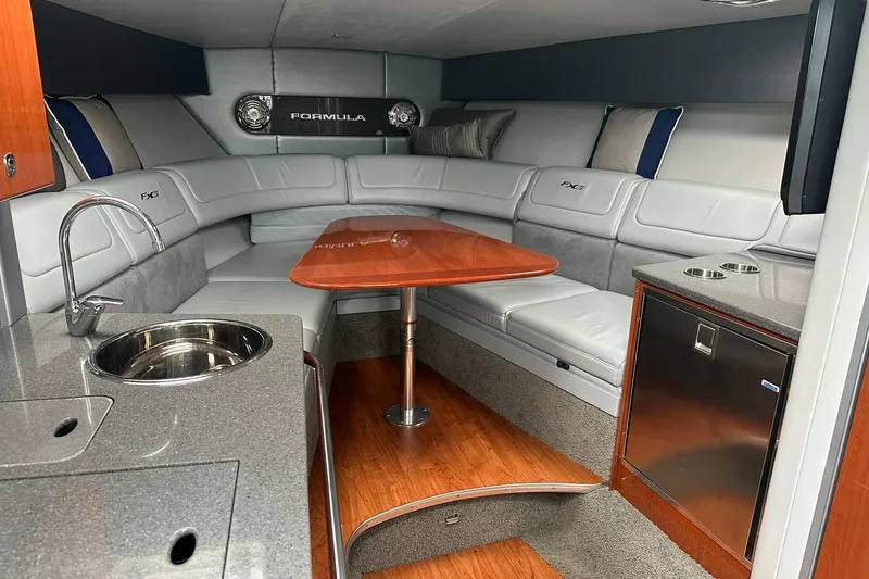 Slide: The Image of Luxurious interior of a 2012 Formula 350 FX6 boat with modern amenities. - 16