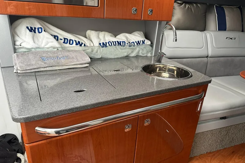 Slide: The Image of Interior of 2012 Formula 350 FX6 boat with kitchenette and seating area. - 19